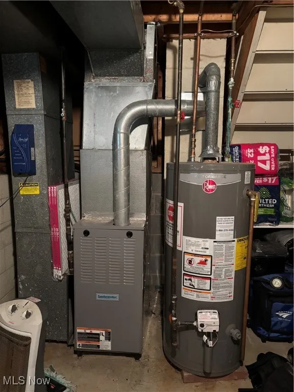 Utility room with water heater and heating unit