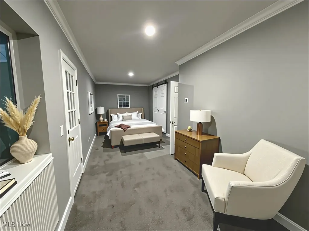 Bedroom featuring ornamental molding and carpet