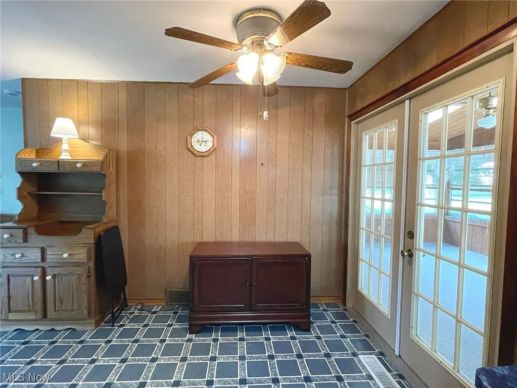 Dining area with atrium door that leads out to the pretty 3-season sunroom.