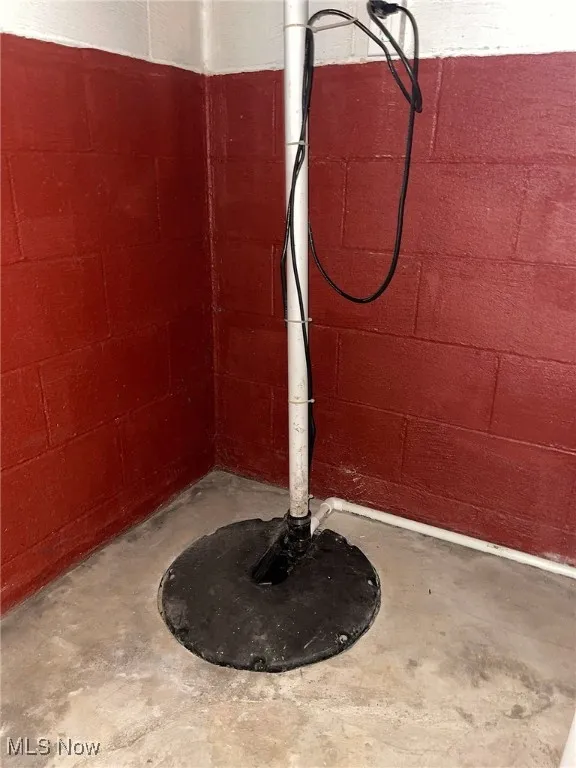 Basement sump pump, showing block wall construction.