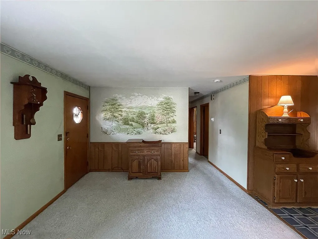 Living room toward the hallway and front door.