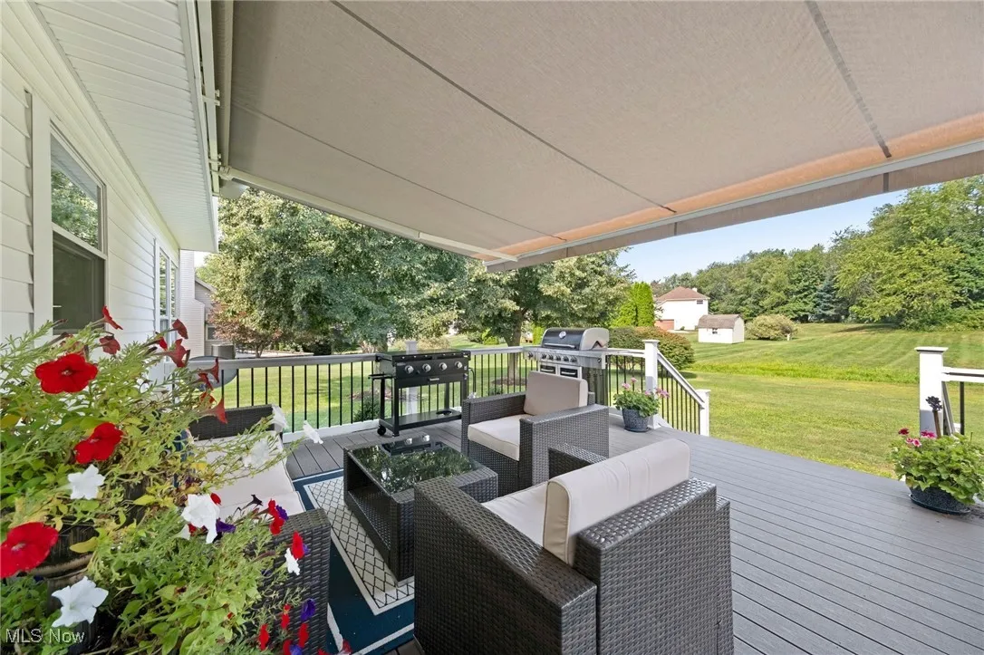 Deck living space w Sunsetter awning extended
