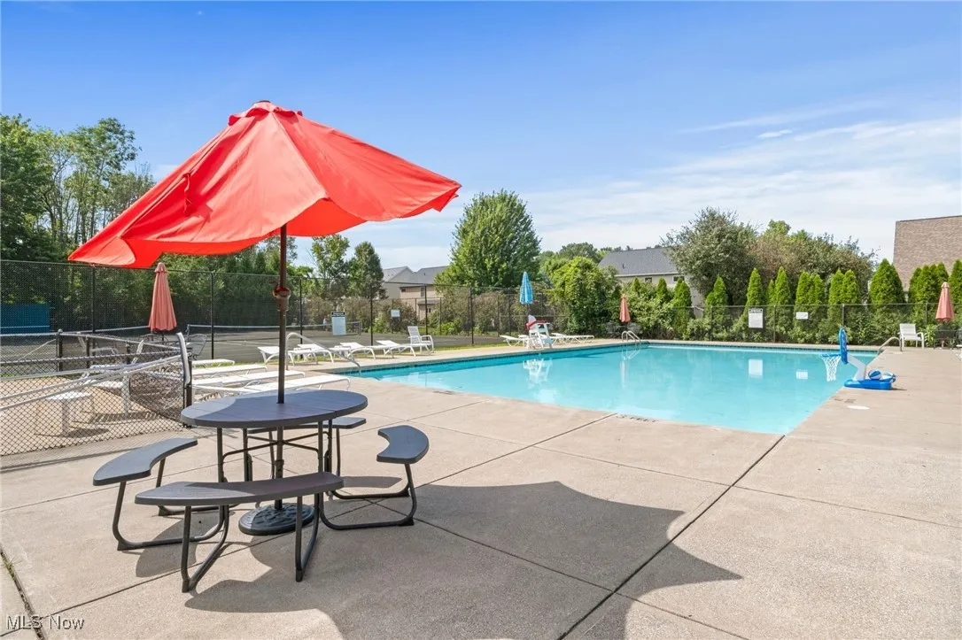 Community pool with a patio area
