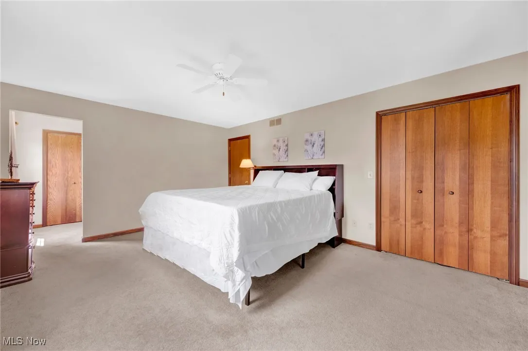 Primary Bedroom features His and Hers closets.
