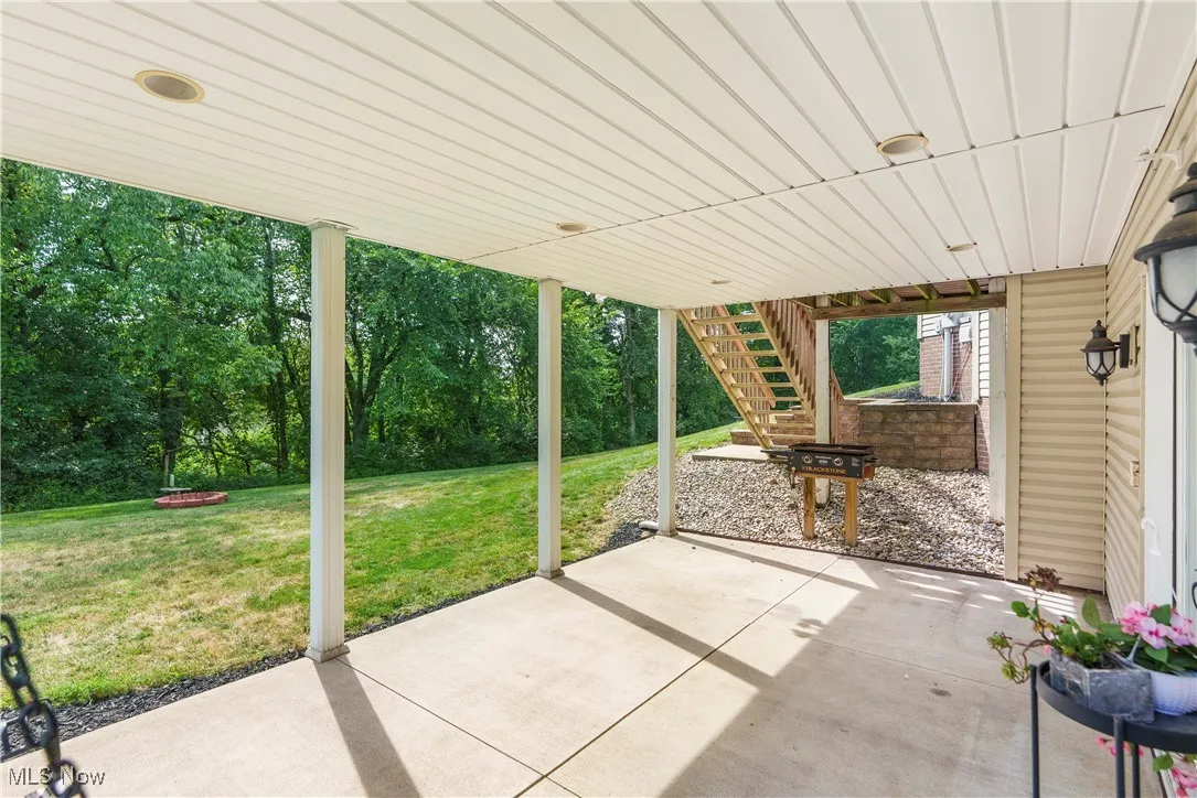 View of patio featuring stairway