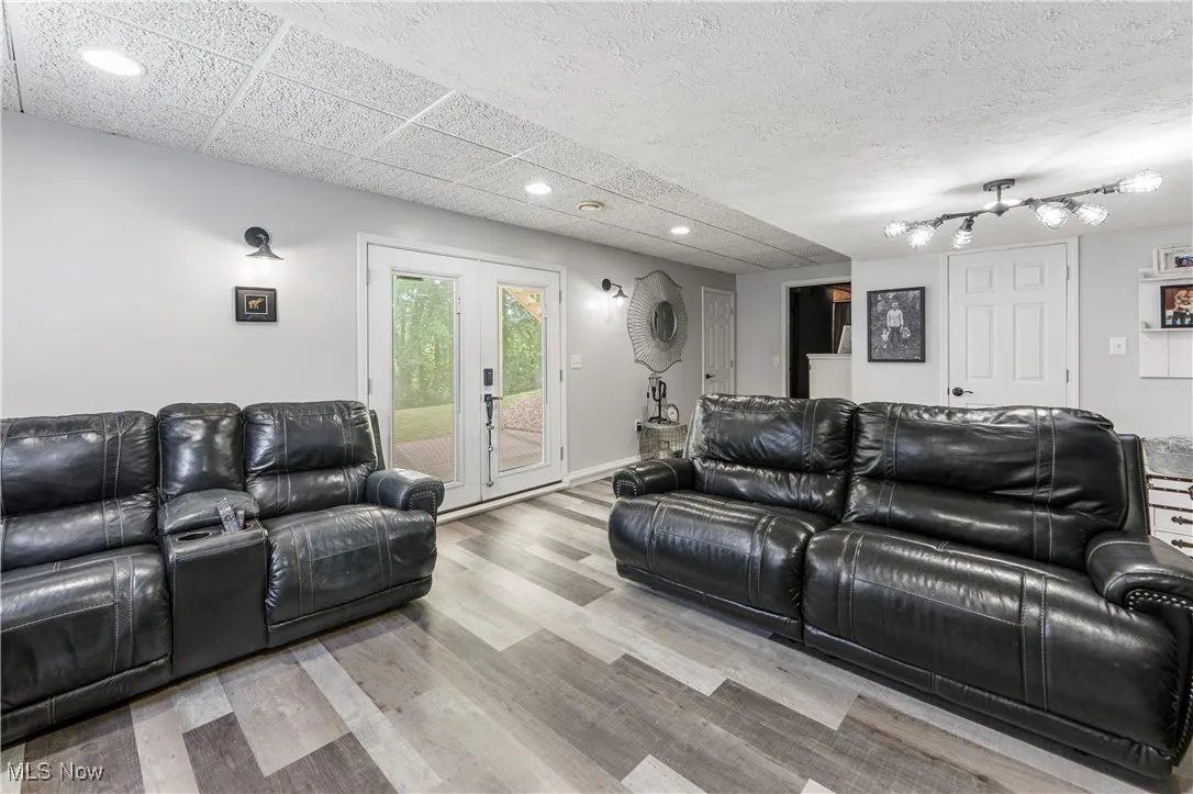 Living room with recessed lighting and wood finished floors