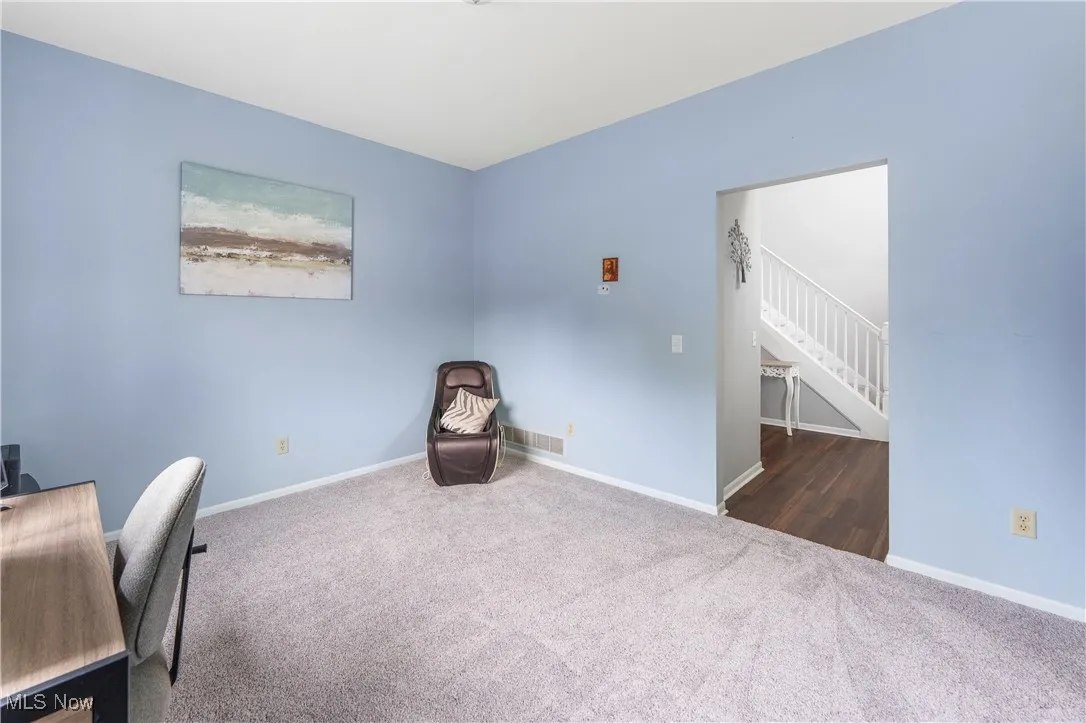 Office space with carpet floors and baseboards