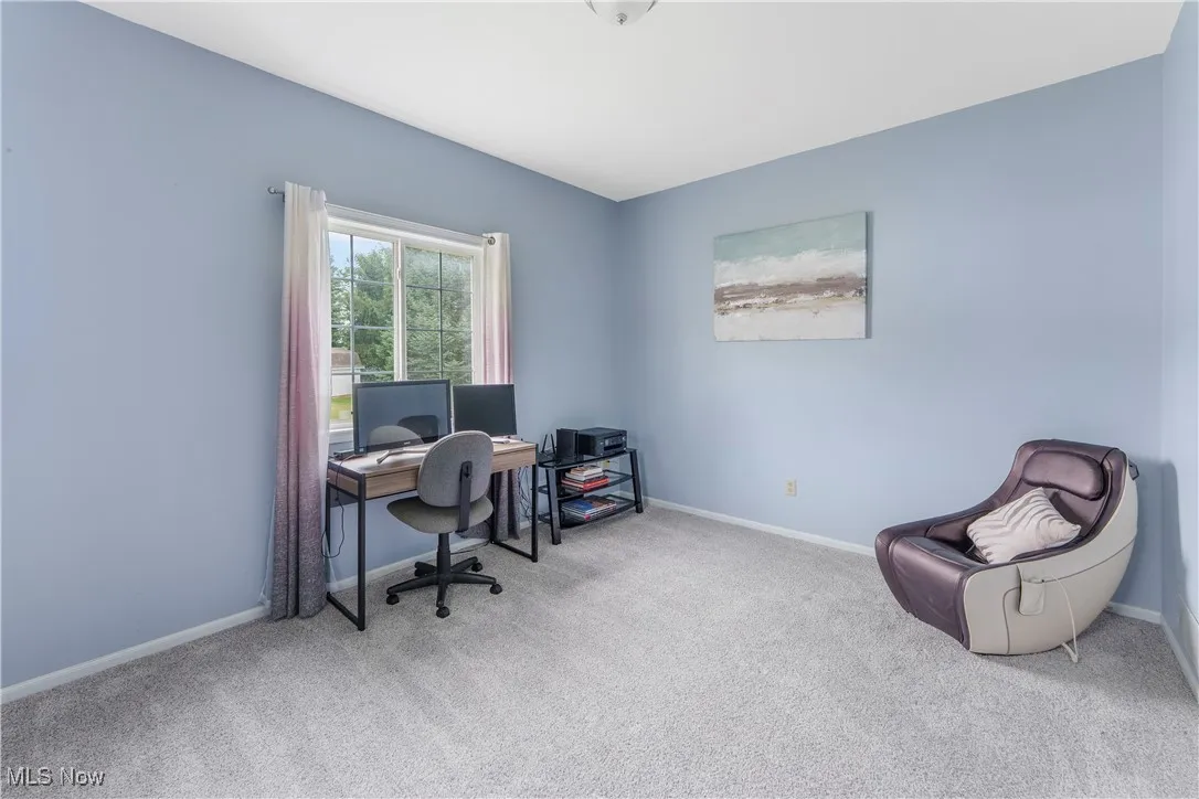 Office space featuring baseboards and carpet flooring