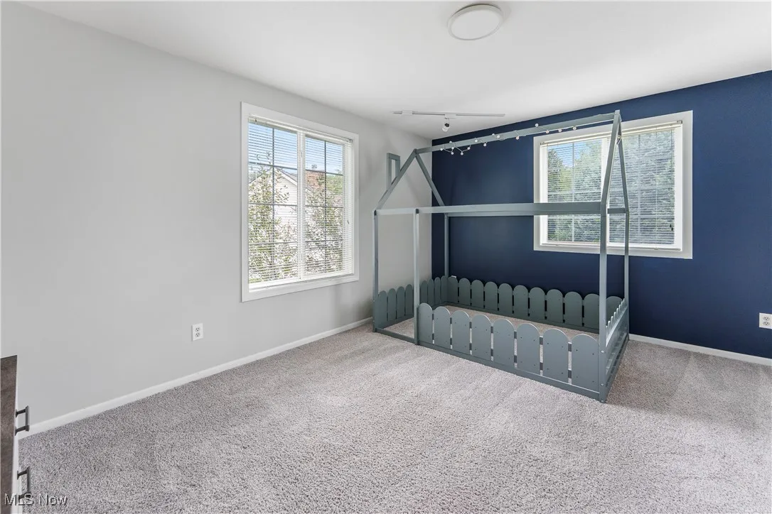 Unfurnished bedroom with carpet