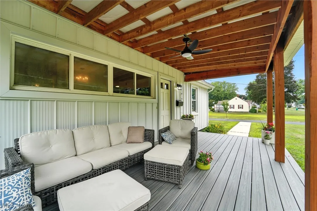 Porch with ceiling fan and an outdoor hangout area