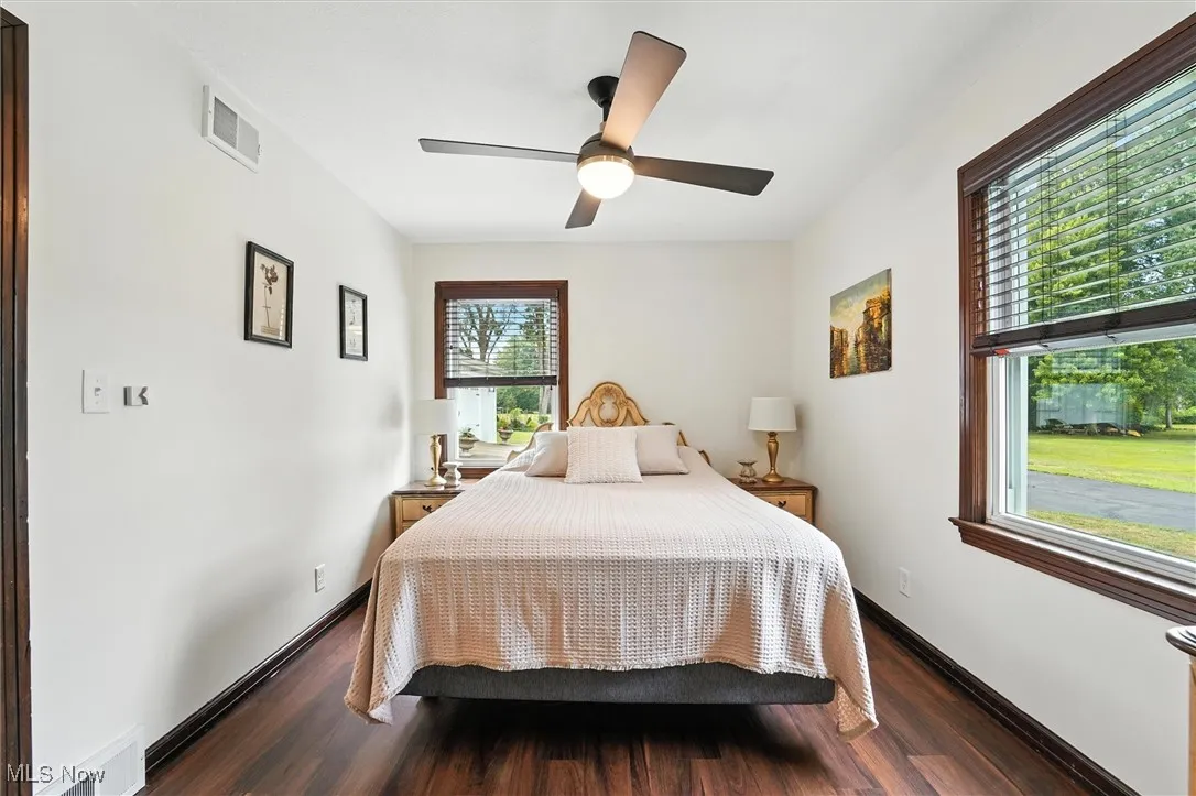 Bedroom featuring wood finished floors and ceiling fan