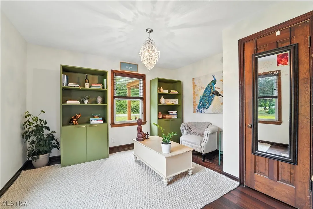 Sitting room featuring a chandelier and wood finished floors