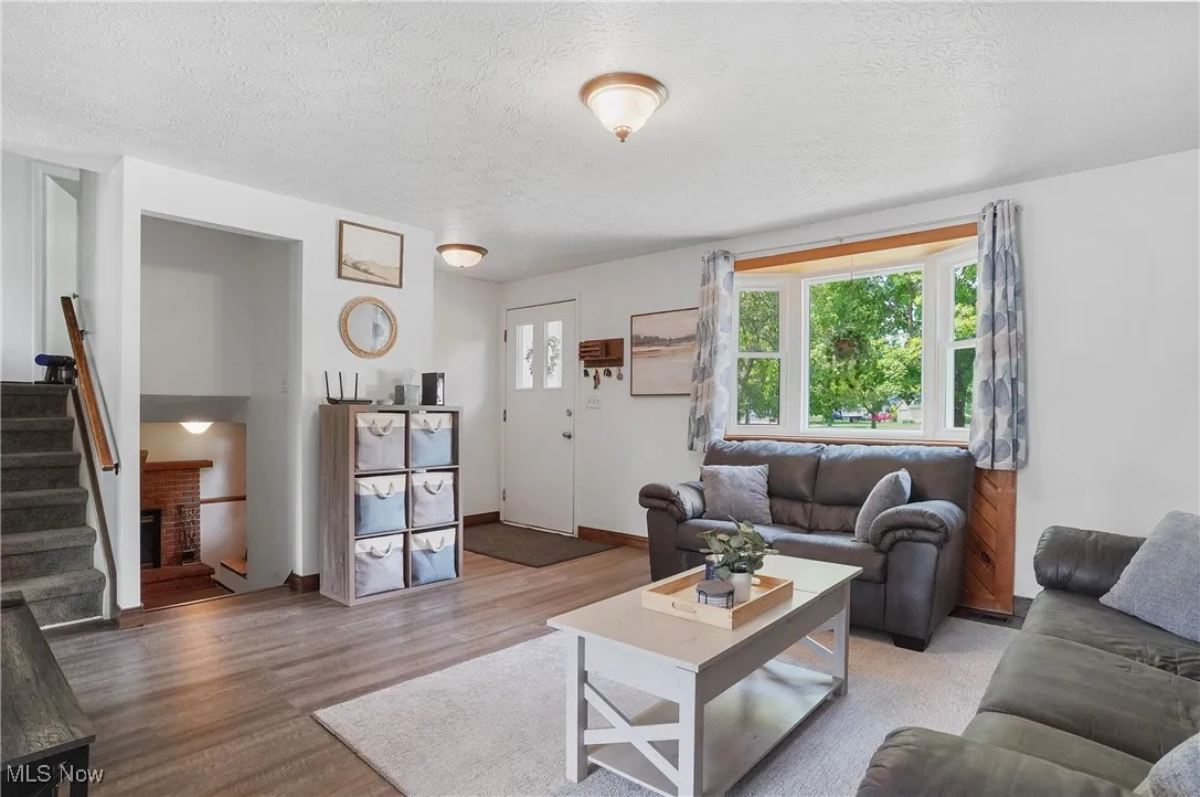Living area with stairs, laminate floors