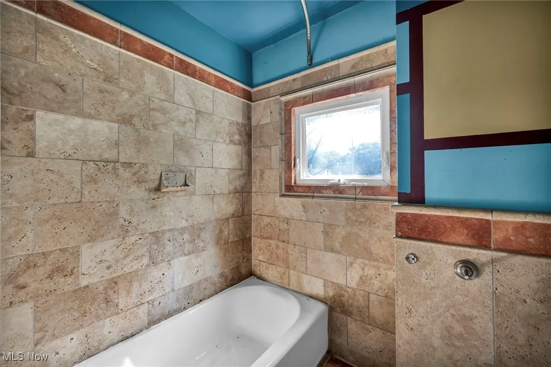 Full bath with a bath