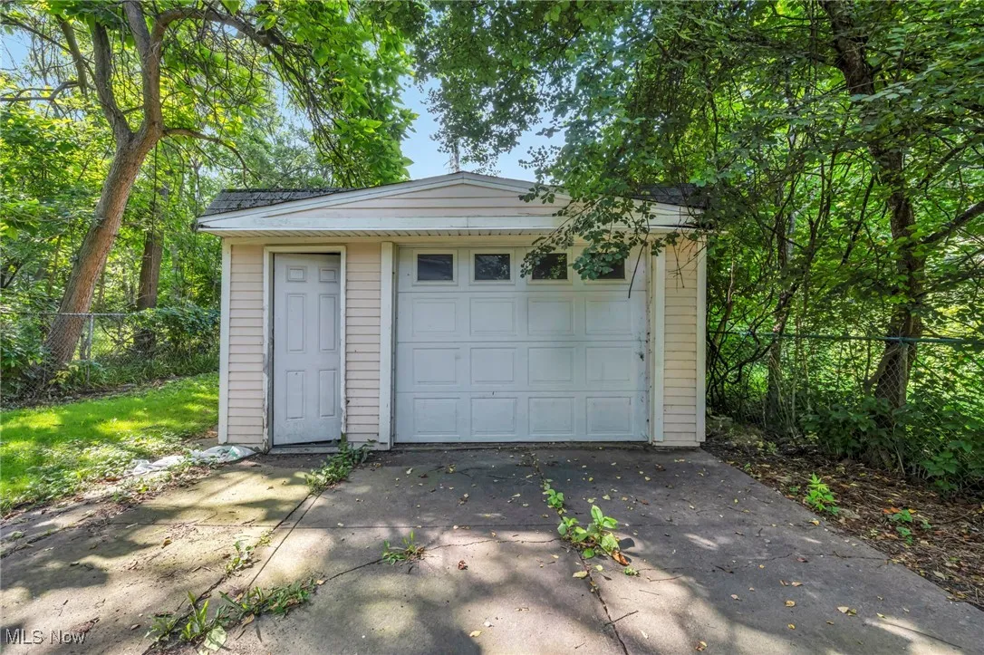 Garage featuring driveway