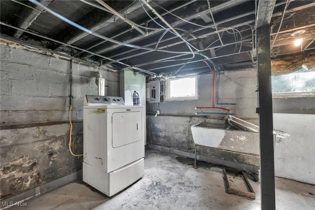 Basement featuring washer / dryer and electric panel