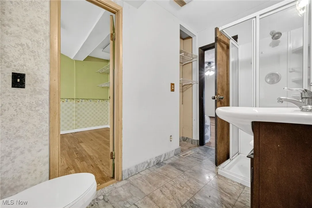 Jack & Jill Bathroom featuring a stall shower
