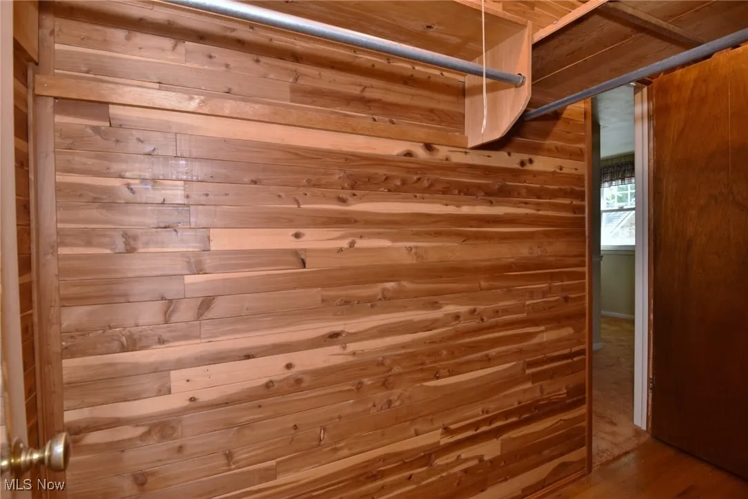 View of large cedar closet in the upstairs hallway, connected to Bedroom #3