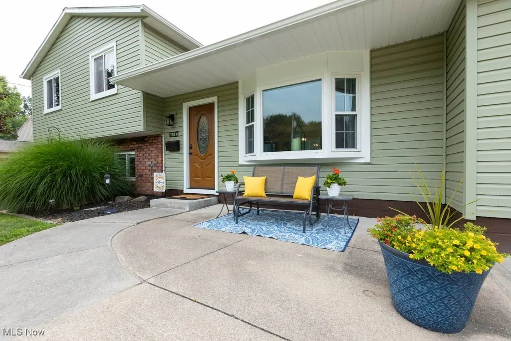 Doorway to property with brick siding
