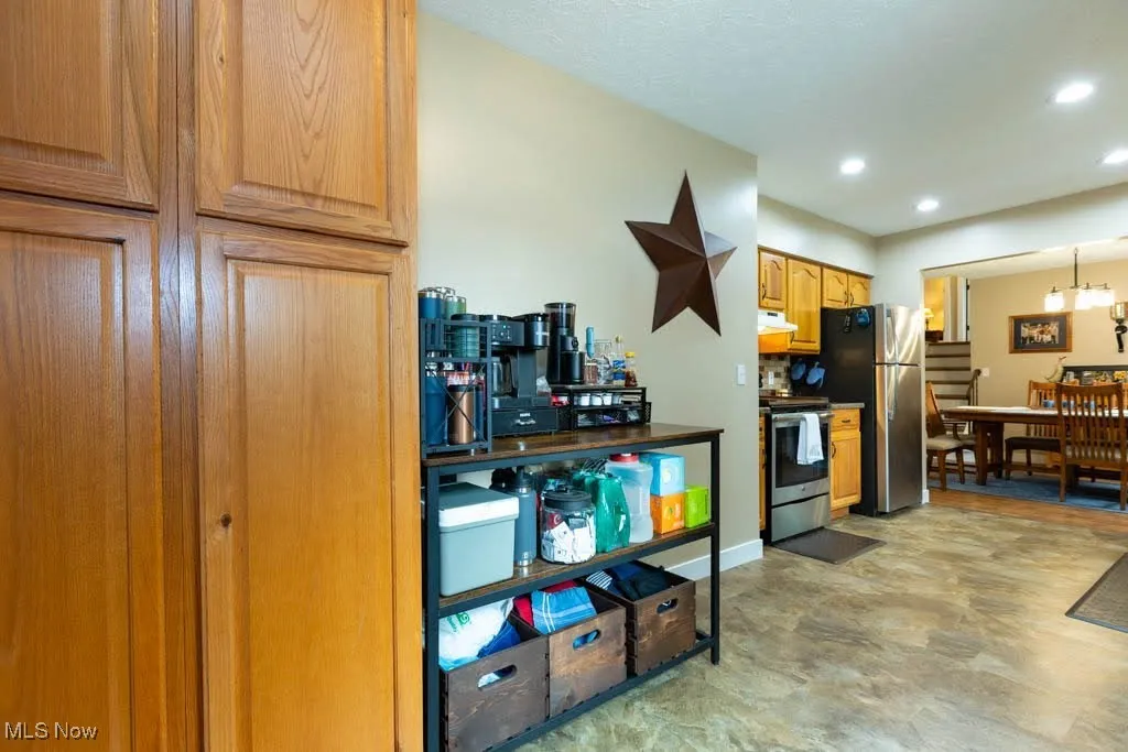 Kitchen featuring electric stove and recessed lighting