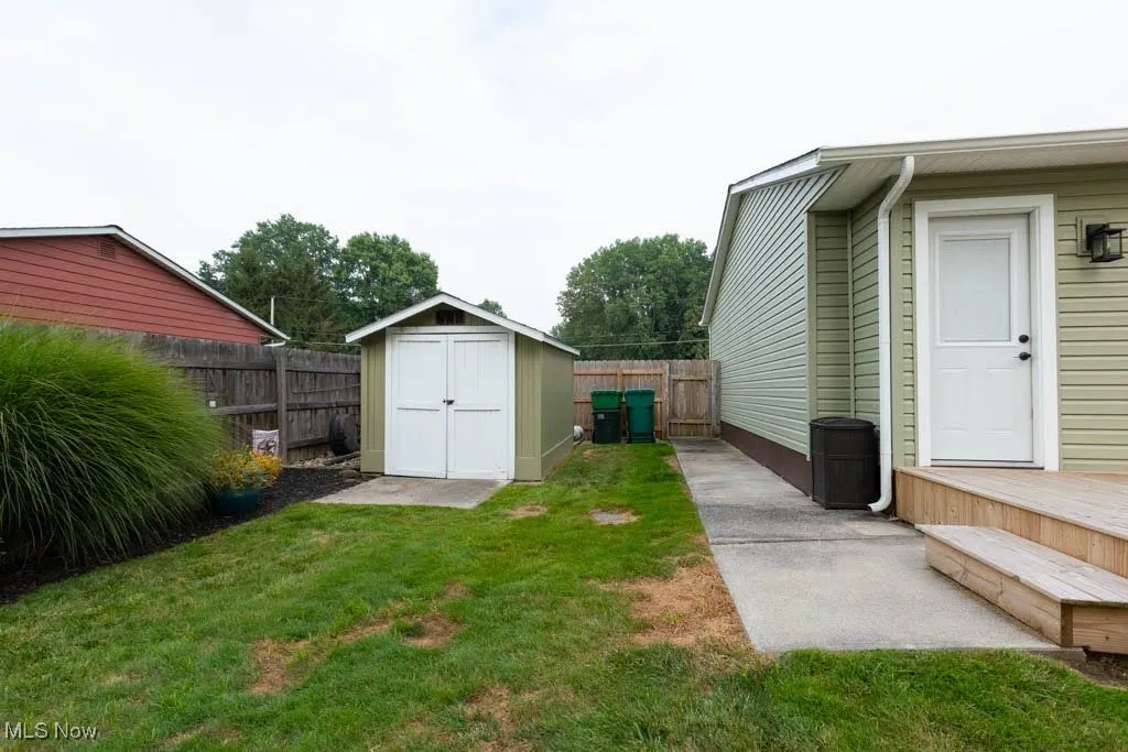 Fenced backyard with a shed