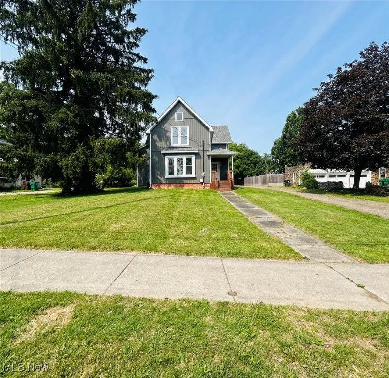 View of front facade with board and batten siding