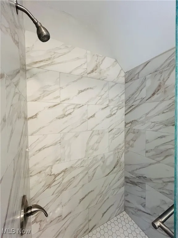 Full bath with tiled shower