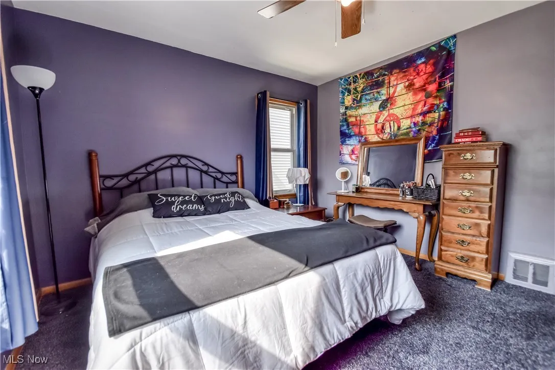 Bedroom with carpet flooring and ceiling fan