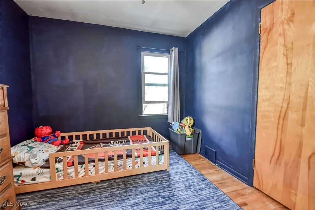 Bedroom with wood finished floors