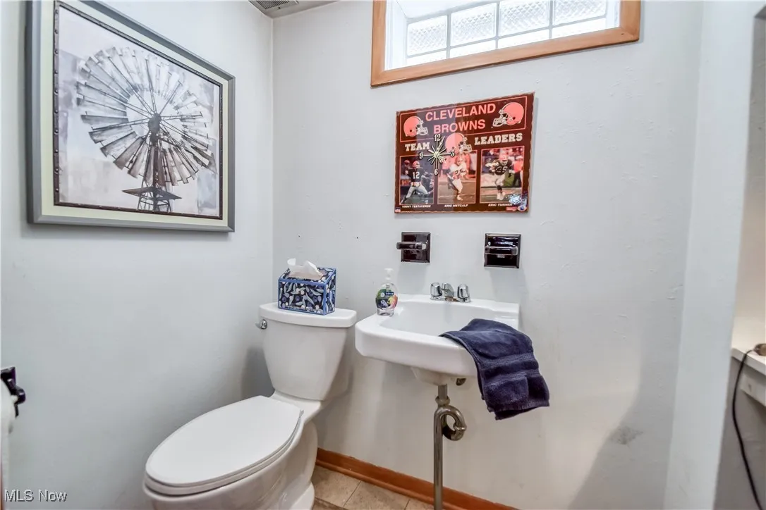Bathroom featuring toilet and tile patterned floors
