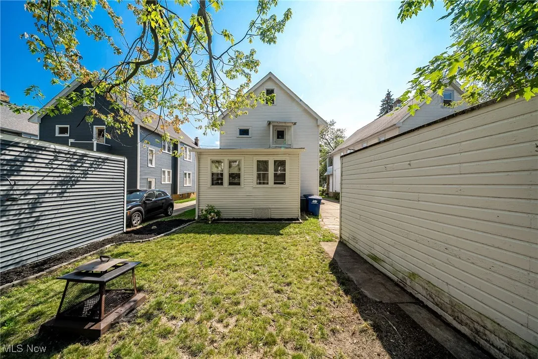 Back of house featuring a yard