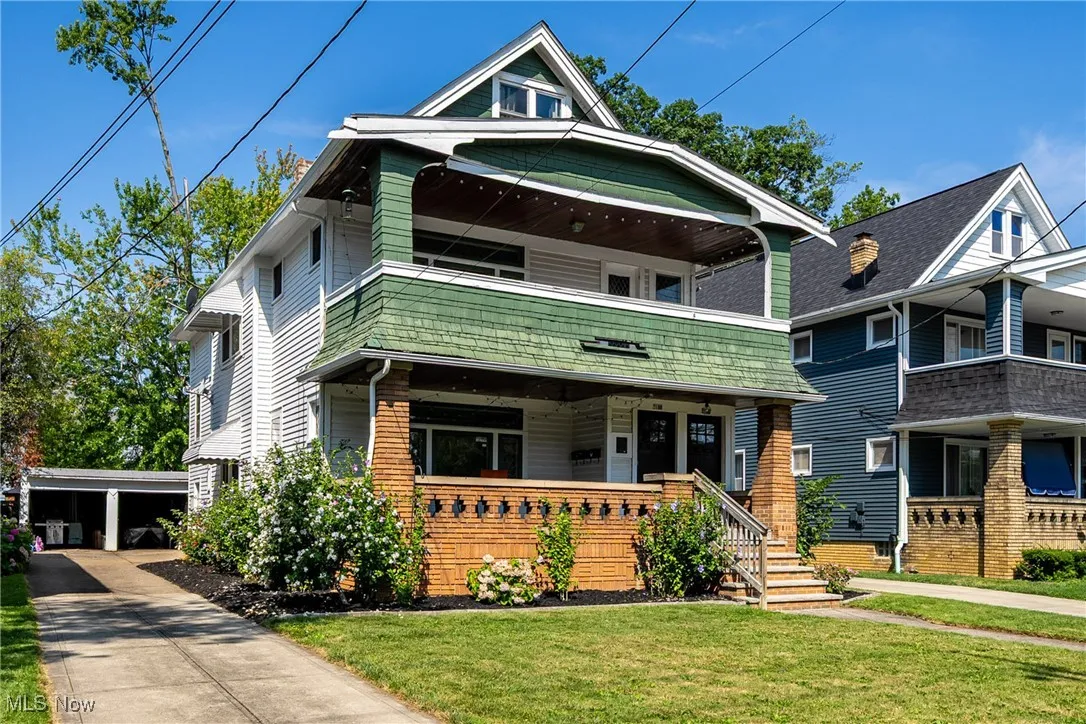 View of front facade featuring a porch and a front lawn