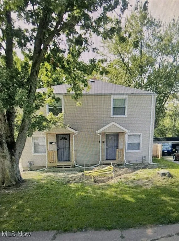View of front of property with a front yard