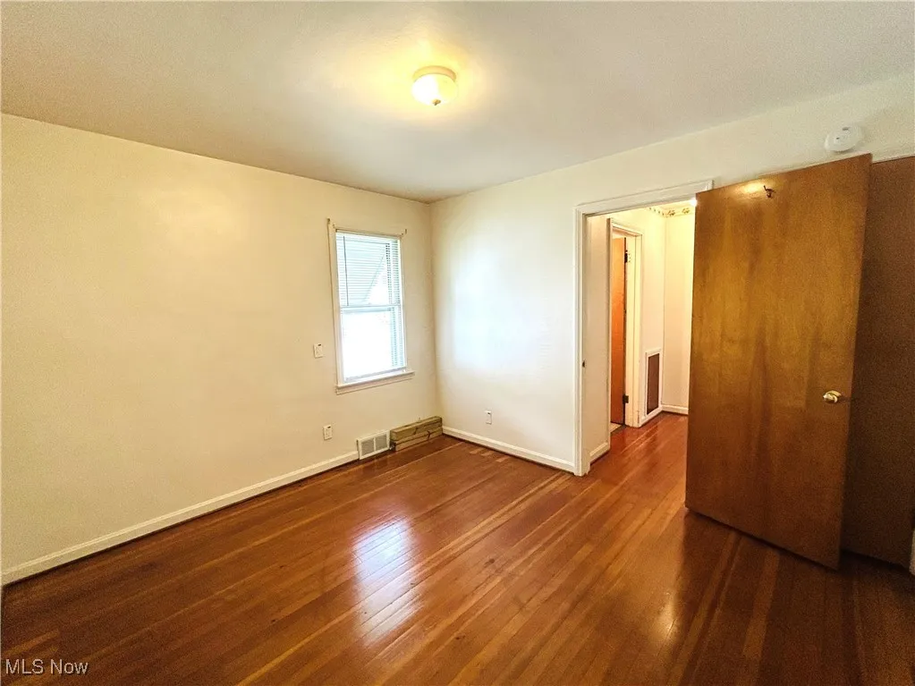 Bedroom featuring wood-type flooring