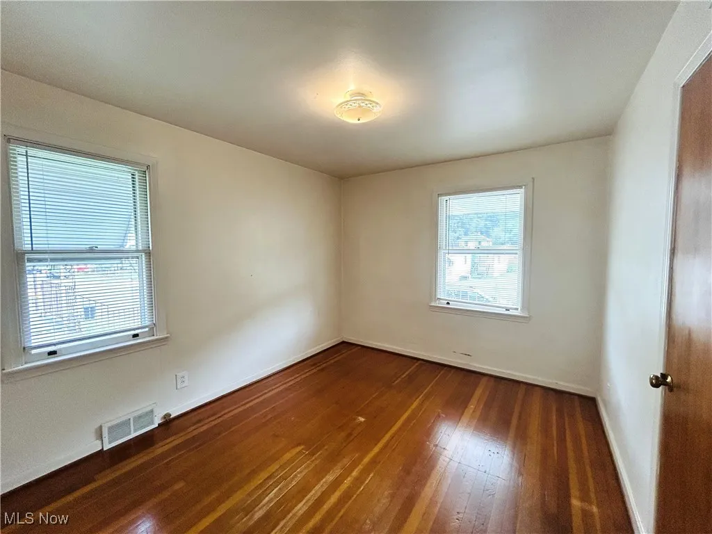 Bedroom featuring wood-type flooring