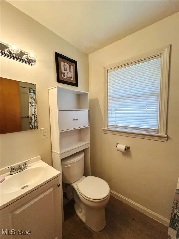Full bathroom featuring vanity, and toilet