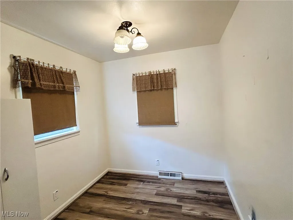  Bedroom with wood finished floors