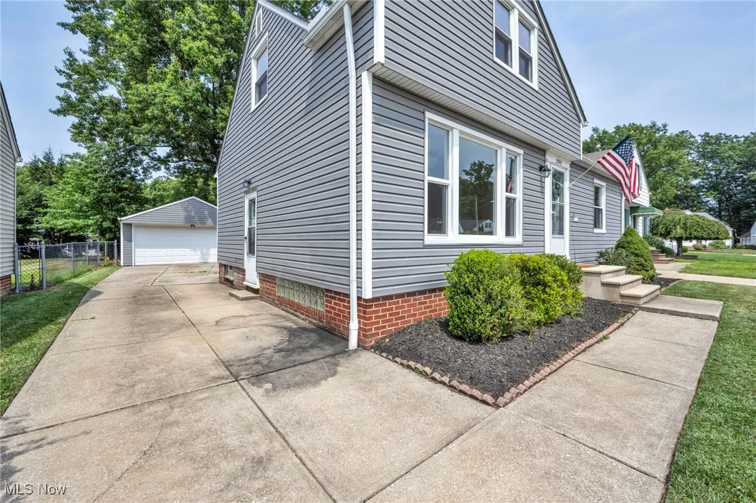View of home's exterior with an outdoor structure and a garage