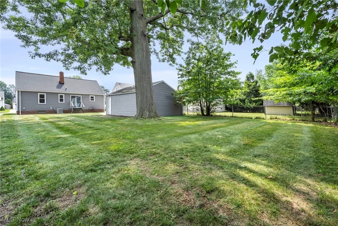 View of yard featuring a storage unit