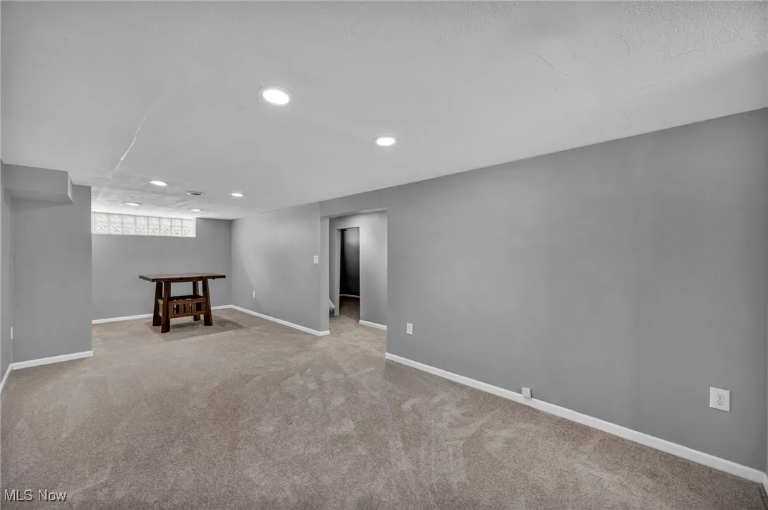 Basement featuring carpet flooring and recessed lighting