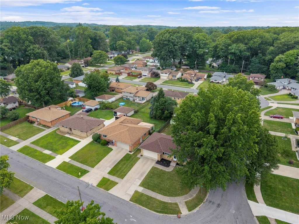Aerial view of property's location featuring nearby suburban area