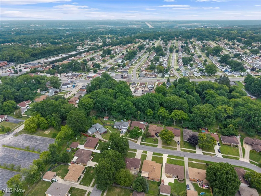 Aerial view of property's location featuring nearby suburban area