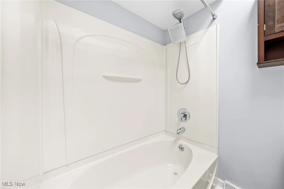 Bathroom with shower / bath combination