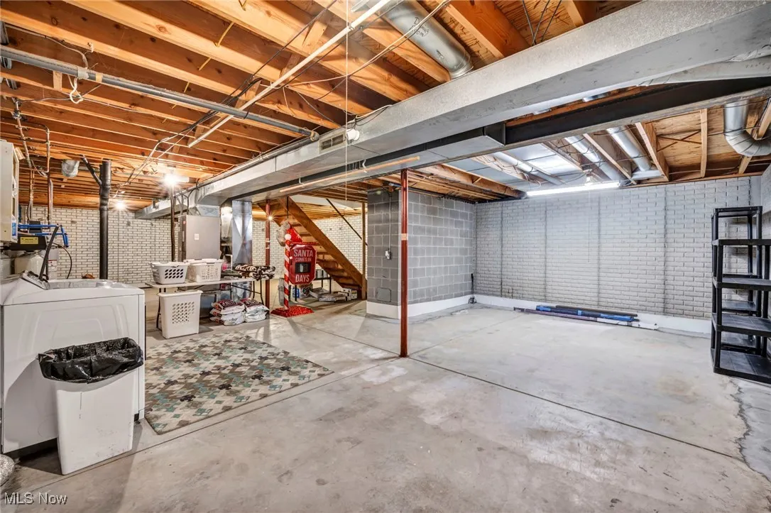 Unfinished basement featuring stairs