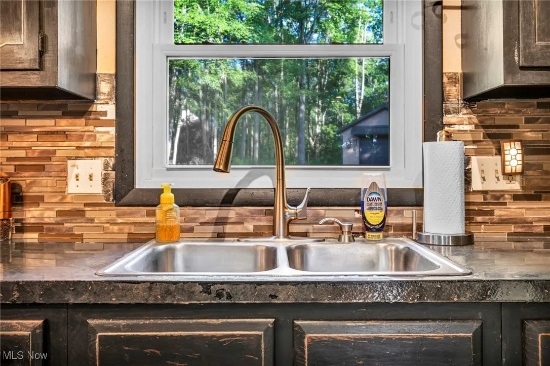 Kitchen view of backsplash and a sink