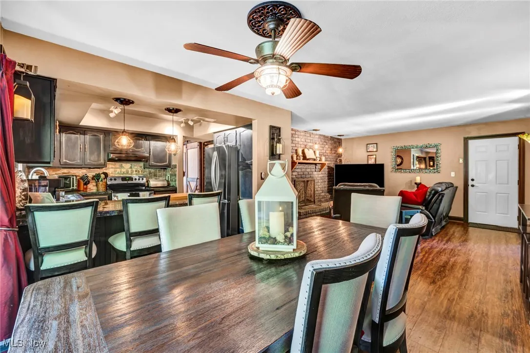 Dining area featuring ceiling fan and wood finished floors