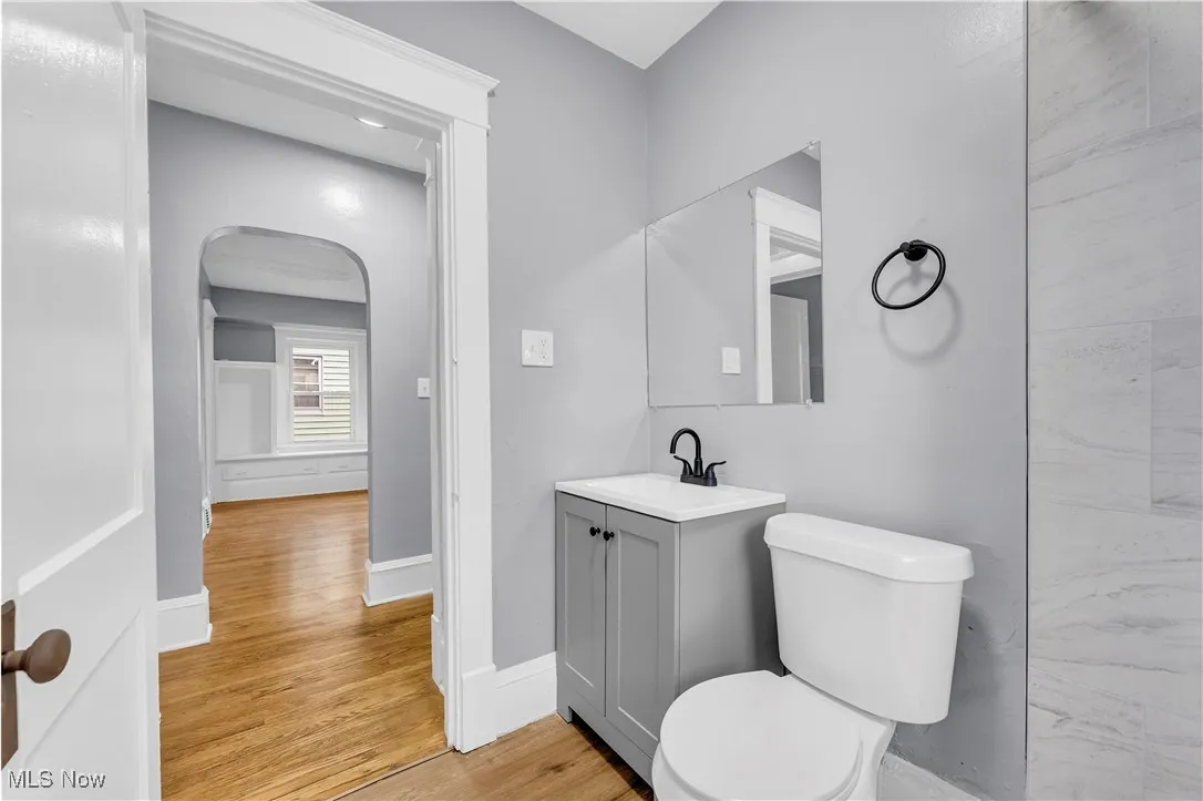 Bathroom featuring vanity and wood finished floors