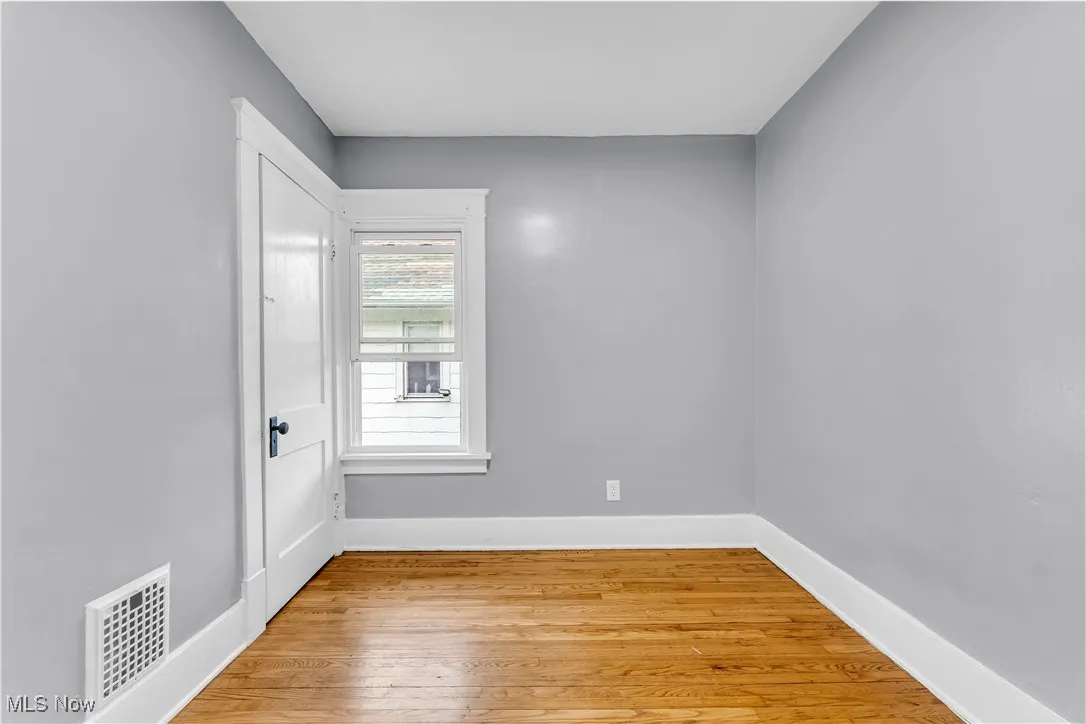 Spare room featuring light wood-type flooring