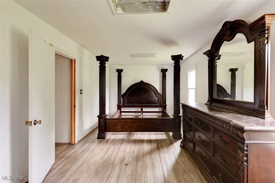Bedroom with light wood finished floors