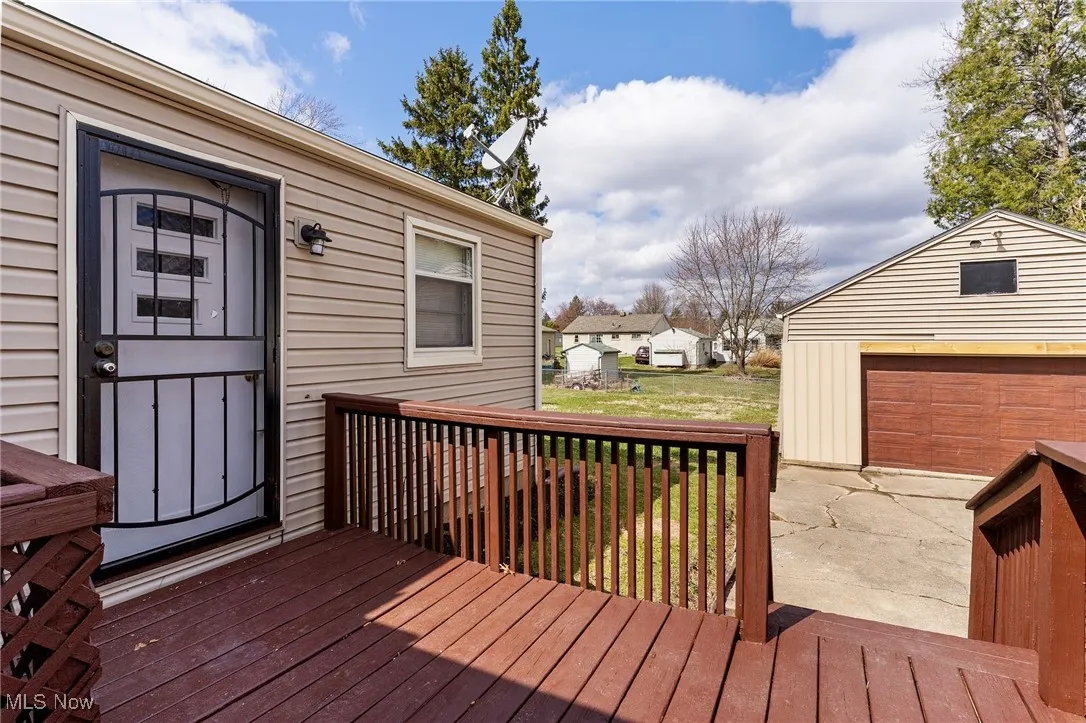 Wooden deck featuring an outdoor structure